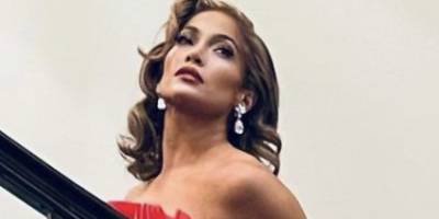 Jennifer Lopez Channels Mrs. Claus in a Bright Red Strapless Gown - www.harpersbazaar.com