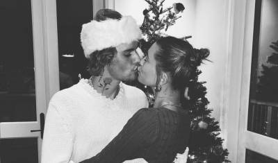 Justin Bieber Shares Christmas Kiss with Wife Hailey in Front of Their Tree - www.justjared.com