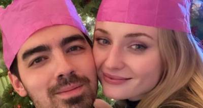 SELFIE: Joe Jonas and Sophie Turner adorn matching paper crowns as they pose in front of their Christmas tree - www.pinkvilla.com