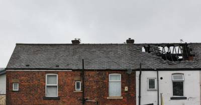 Homes evacuated after fire tears through terrace in Heywood - www.manchestereveningnews.co.uk - Manchester