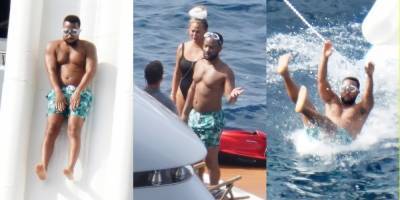 Shirtless John Legend Slides Down a Yacht During Family Vacation with Chrissy Teigen! - www.justjared.com