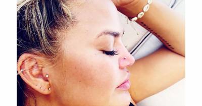 Chrissy Teigen Got Her Nose Pierced While on Vacation But It Didn’t Exactly Work Out - www.usmagazine.com