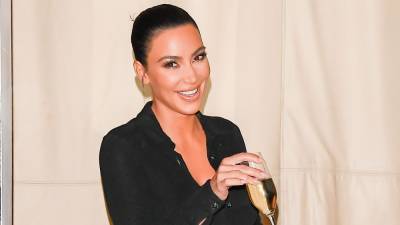 Kim Kardashian Wears a Mini-Dress of Her Own Face Printed On It - www.etonline.com