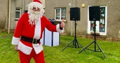 DJ Santa has East Kilbride street 'Rockin' Around the Christmas Tree' in festive treat - www.dailyrecord.co.uk - Santa - county Crawford