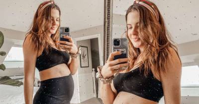 Pregnant Binky Felstead shows off her baby bump in a sports bra - www.msn.com