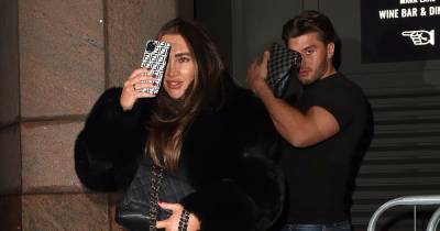 Lauren Goodger looks shy as she hides behind her bag during date with boyfriend Charles Drury - www.ok.co.uk