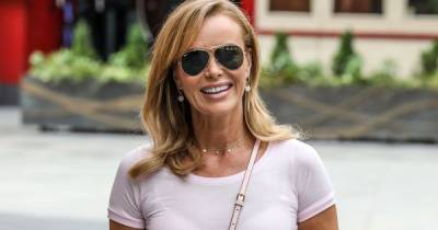 Amanda Holden oozes glamour in gorgeous blue silk skirt and Fendi bag as she heads home from work - www.ok.co.uk