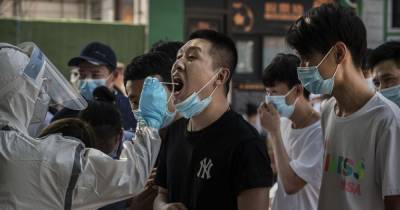 'Alarm bell rung' as China raises coronavirus alert level amid surge of new cases - www.manchestereveningnews.co.uk - China - city Beijing
