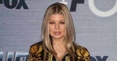 Fergie has stepped away from the Black Eyed Peas to focus on being a mum - www.msn.com