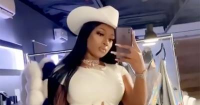 Megan Thee Stallion Slays in a Teeny Thong, Thigh-High Boots and a Cowboy Hat - www.usmagazine.com
