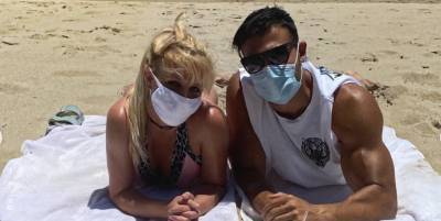 Britney Spears Donned a Tiny Bikini and Face Mask for a Social-Distanced Beach Date with Her Beau - www.harpersbazaar.com