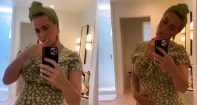 Katy Perry flaunts her baby bump as she dances to Daisies' remix in front of the mirror; Watch Video - www.pinkvilla.com