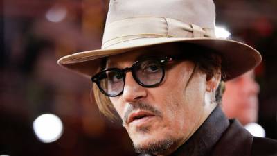 UK judge says Depp broke court order in Sun libel case - abcnews.go.com - Britain