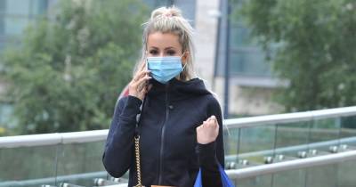 Olivia Attwood puts safety first as she wears face mask after splashing the cash on designer goods - www.ok.co.uk - Manchester - Hague
