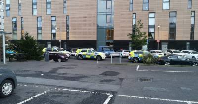 Armed police race to Glasgow flats after 'ongoing incident' in West End - www.dailyrecord.co.uk
