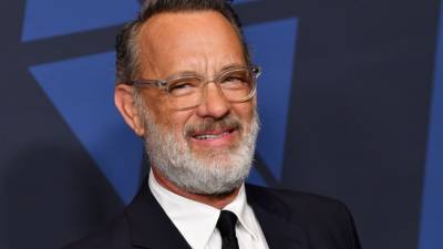 Tom Hanks Celebrates His 64th Birthday With a Huge Dive Into a Pool - www.etonline.com