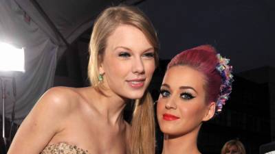 Katy Perry Says She and Taylor Swift 'Fight Like Cousins,' Addresses Rumor They're Related - www.etonline.com