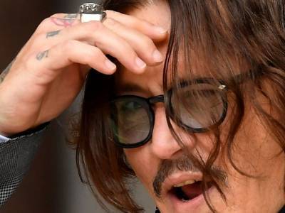 Johnny Depp says Amber Heard hit him with a 'haymaker' after losing $650M - torontosun.com - Britain