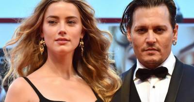 Johnny Depp says Amber Heard punched him in bed on day he found out he'd lost his $650m fortune - www.dailyrecord.co.uk