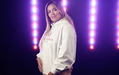 Karol G says she’s feeling well after testing positive for coronavirus - www.nme.com - Colombia