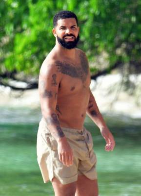 Drake Spotted Shirtless While Walking The Beach In Barbados - etcanada.com - Barbados - county Canadian