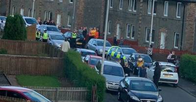 Police attacked after crowd protests over alleged 'paedophile' resident in Scots street - www.dailyrecord.co.uk - Scotland