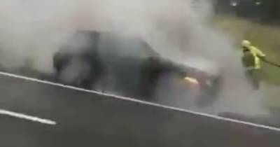 Shocking scene on M8 near Glasgow as car goes up in flames by side of road - www.dailyrecord.co.uk - Scotland