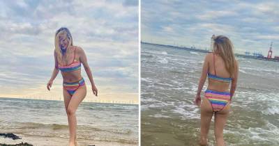Laura Whitmore shocks fans as she braves the sea in Merseyside wearing nothing but a rainbow bikini - www.ok.co.uk