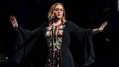 Adele wore her Glastonbury Festival dress to watch it and needs you to calm down about a new album - edition.cnn.com