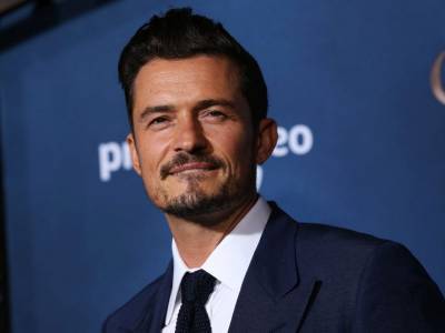Orlando Bloom mourns loss of puppy, gets tribute tattoo over his heart - canoe.com