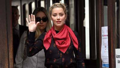 Amber Heard Accuses Johnny Depp of Throwing Bottles Like "Grenades" - www.hollywoodreporter.com - Australia - Britain - London