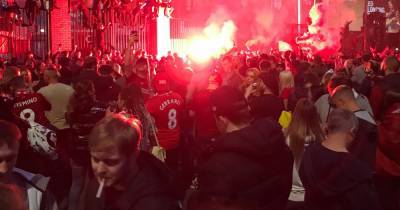 Police put 'dispersal order' around Anfield as Liverpool fans ignore advice to celebrate Premier League win at home - www.manchestereveningnews.co.uk