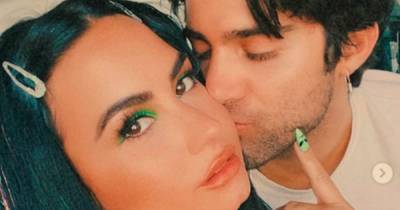 Demi Lovato engaged to boyfriend Max Ehrich after five months together as star shows of huge diamond ring - www.ok.co.uk