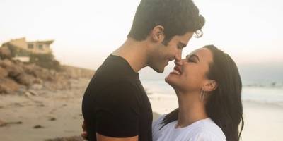 Demi Lovato and Max Ehrich Announce Engagement with Gorgeous Beachside Photos - www.harpersbazaar.com