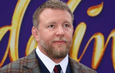 Guy Ritchie banned from driving for six months after YouTuber catches him texting at wheel - www.nme.com