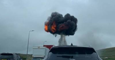 Video shows horrific moment crane bursts into flames on M62 - www.manchestereveningnews.co.uk