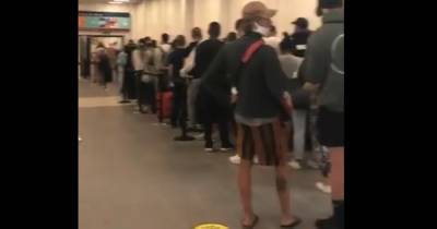 Queue chaos at Luton Airport as holidaymakers from Spain ignore social distancing - www.manchestereveningnews.co.uk - Britain - Spain