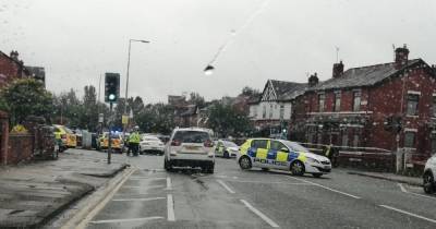 Road remains closed seven hours after man suffers life-threatening injuries in horror smash - www.manchestereveningnews.co.uk