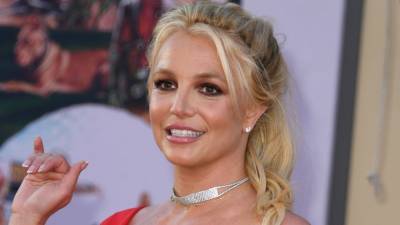 Britney Spears Says She’s ‘Demanding Attention’ With Full-Body Henna Bikini Pic - www.etonline.com