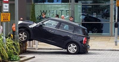 Mini Cooper left airborne after getting stuck on ramp at Media City - www.manchestereveningnews.co.uk - city Media
