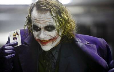 ‘The Dark Knight’ writer says Warner Bros. wanted to include a Joker origin story - www.nme.com