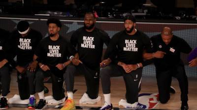 LeBron James and Fellow NBA Players Kneel for National Anthem in Black Lives Matter Shirts as Season Returns - www.etonline.com - Los Angeles - Los Angeles - Florida - New Orleans - Utah - Lake - county Buena Vista