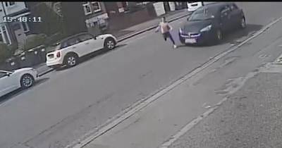 The terrifying moment a girl, 11, runs into road and gets hit by car that police want you to see - www.manchestereveningnews.co.uk