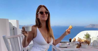 Millie Mackintosh stuns in plunging white swimsuit while soaking up the sun on holiday in Greece - www.ok.co.uk - Taylor - Chelsea - Greece - city Santorini