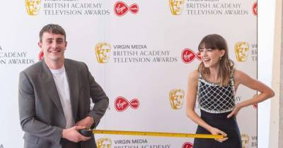 Normal People co-stars Paul Mescal and Daisy Edgar-Jones pose with tape measure at Bafta TV Awards - www.msn.com - Britain - Centre - city London, county Centre