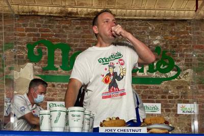Joey Chestnut downs record 75 wieners in Nathan’s hot dog eating victory - nypost.com