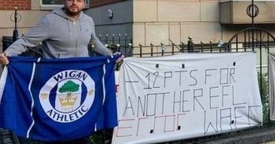Wigan fans protest outside Football League headquarters after club enters administration - www.manchestereveningnews.co.uk - Britain