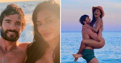 Nicole Scherzinger shows off derrière in sizzling bikini snaps as she poses with beau Thom Evans on beach - www.ok.co.uk - Portugal