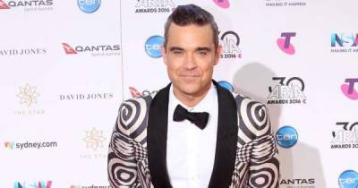 Robbie Williams and daughter spooked by presence in home - www.msn.com - Britain