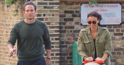 Christine Lampard flashes toned legs in stylish black dress and heels on sunny walk with Frank and Patricia - www.ok.co.uk - London - Chelsea